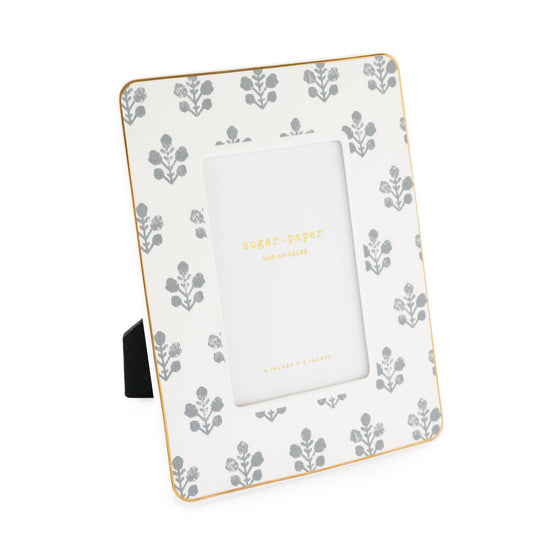 Decorative photo frame with floral pattern on a white background