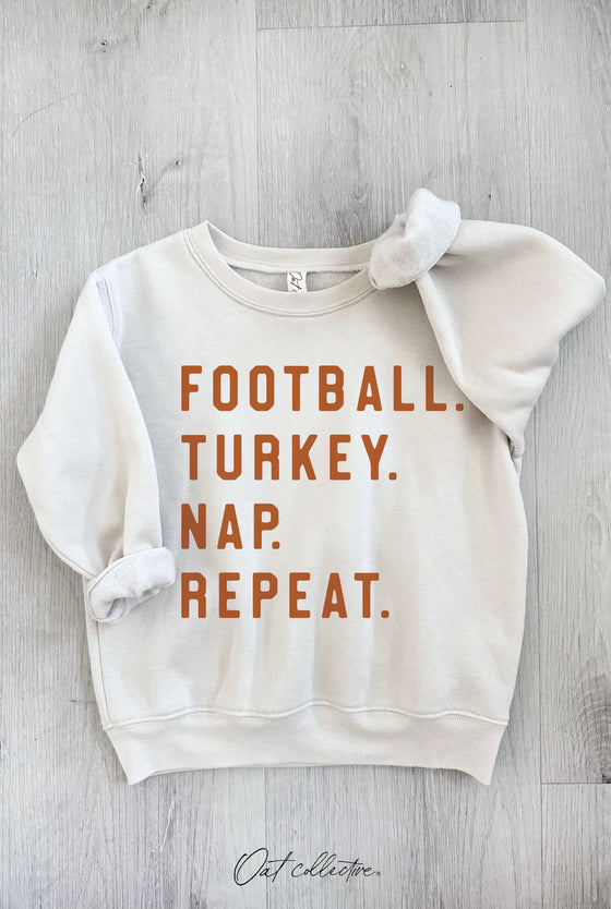 FOOTBALL. TURKEY. NAP. REPEAT. TODDLER SWEATSHIRT