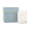 Candle labeled 'Coast' with a matching box on a white background